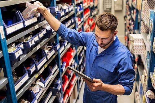 Service technician pulling parts